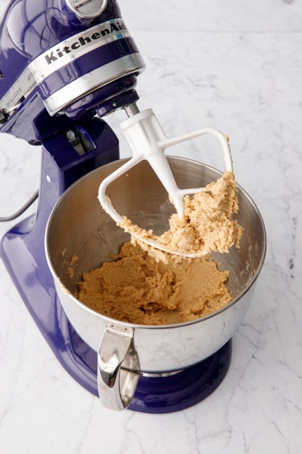 Creamed butter, sugar, and brown sugar in a stand mixer showing the consistency after beating for 3 to 5 minutes.