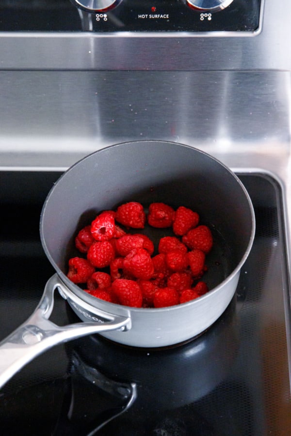 Pot of rasberries on the stove.