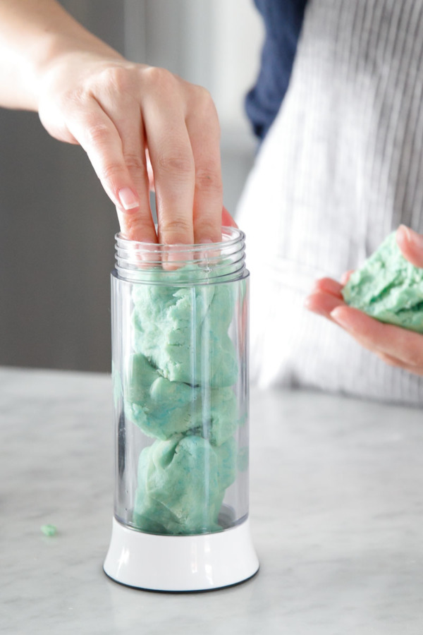 Filling the OXO Cookie Press with dough.