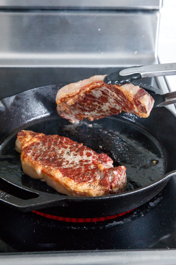 How to Cook Reverse-Sear Steaks: Finish in a screaming-hot skillet for the perfect outer crust.