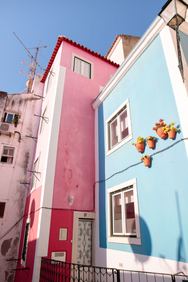 Colorful pink and blue buildings in the Alfama district of Lisbon, Portugal