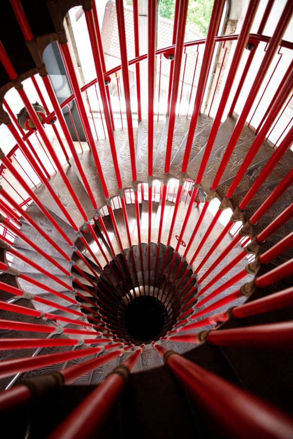 Red double spiral staircase leading up to the castle tower in Ljubljana, Slovenia