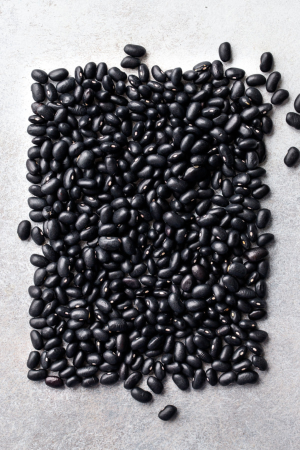 Artistic arrangement of dry black beans in a rectangular shape