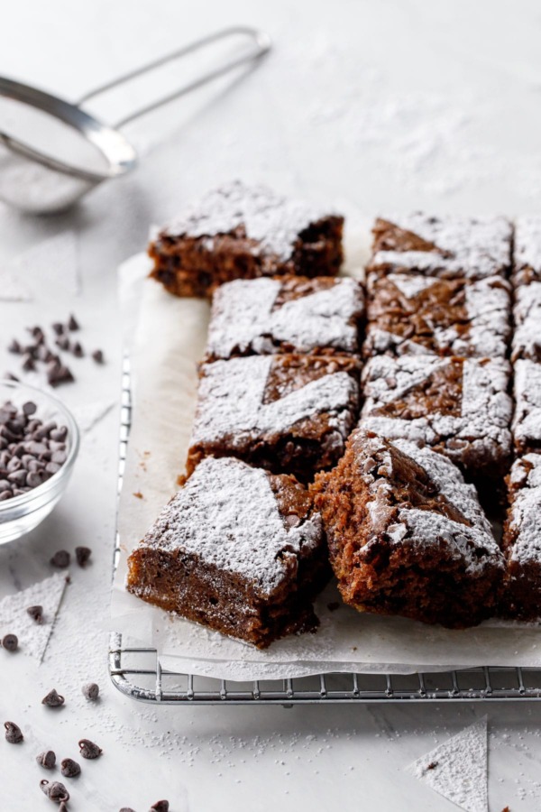 Oatmeal Chocolate Chip Snack Cake Cut into squares, on a wire baking rack