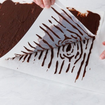Peeling back the stencil reveals the wood grain design!