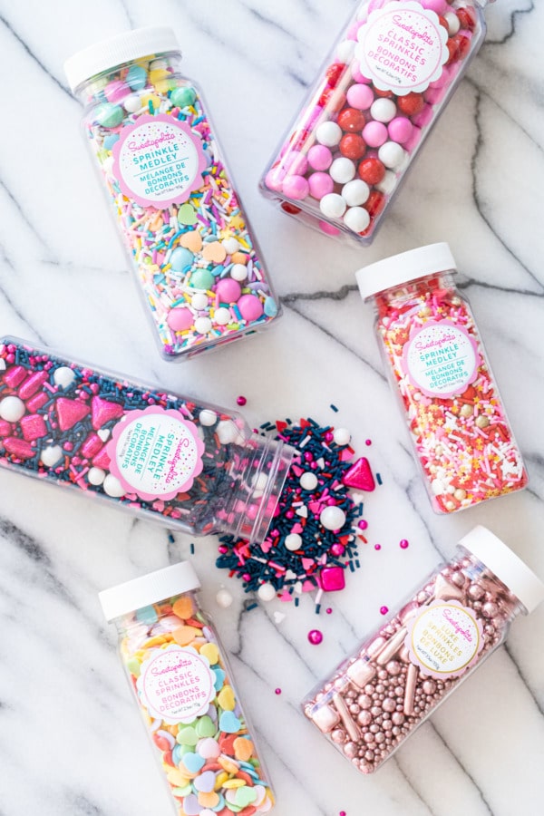 Overhead, Sweetapolita's Valentine's sprinkle medleys on marble background