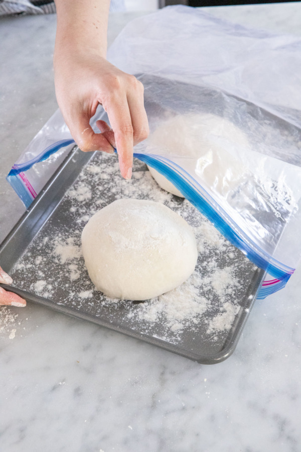 Dough balls can be chilled on a floured surface in a ziptop bag or lightly covered with plastic wrap.