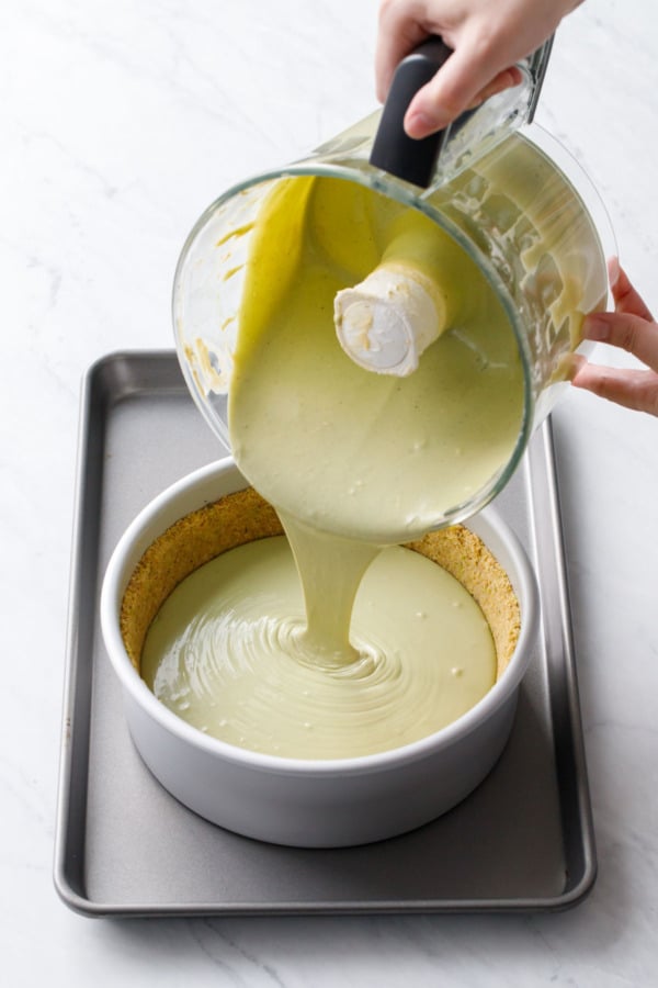 The cheesecake filling should reach about 1/2-inch from the top of the crust.