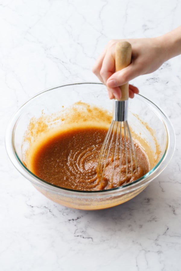 After continued whisking the butter/brown sugar mixture will look smooth and no longer greasy.