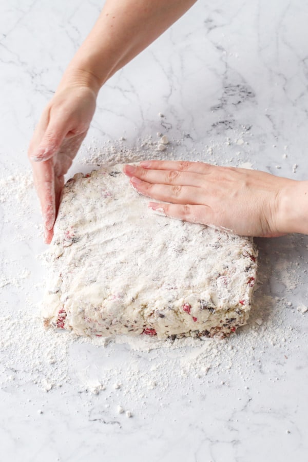 Shaping the scone dough into an even square.