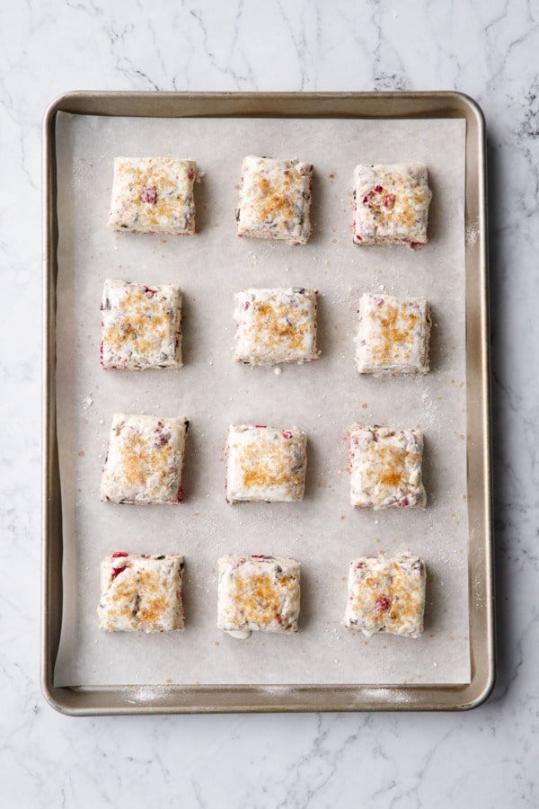 Overhead, squares of scone dough before being baked.