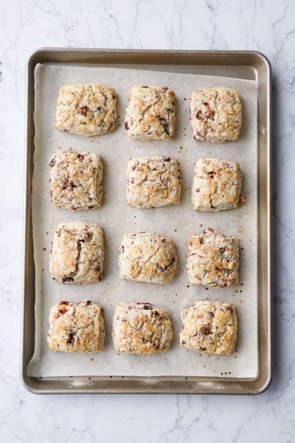 Baked scones will have spread a little bit, with browned bottoms and golden brown tops.