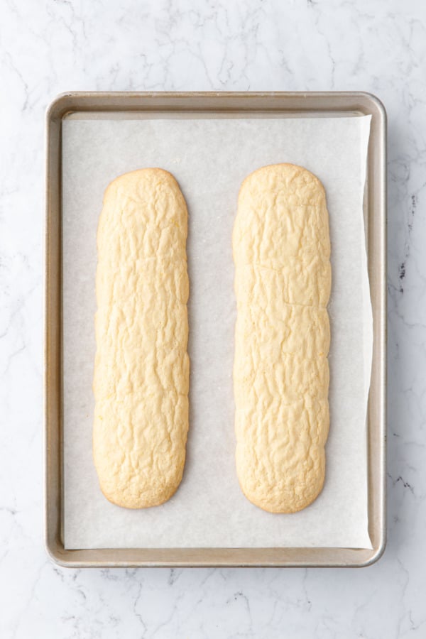 Overhead, biscotti dough after baking shows how much the dough spreads in the oven.