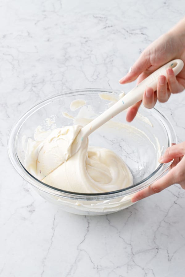 Spatula folding in the second addition of egg whites until uniformly mixed.