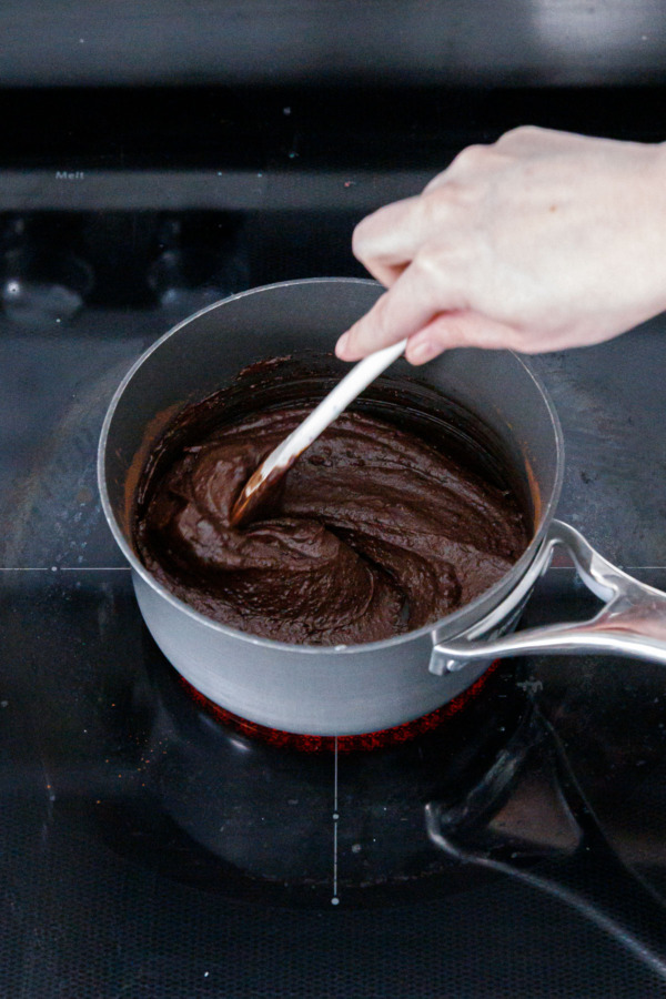Whisking fudge swirl mixture in a small saucepan, it will be thick and pasty at first.