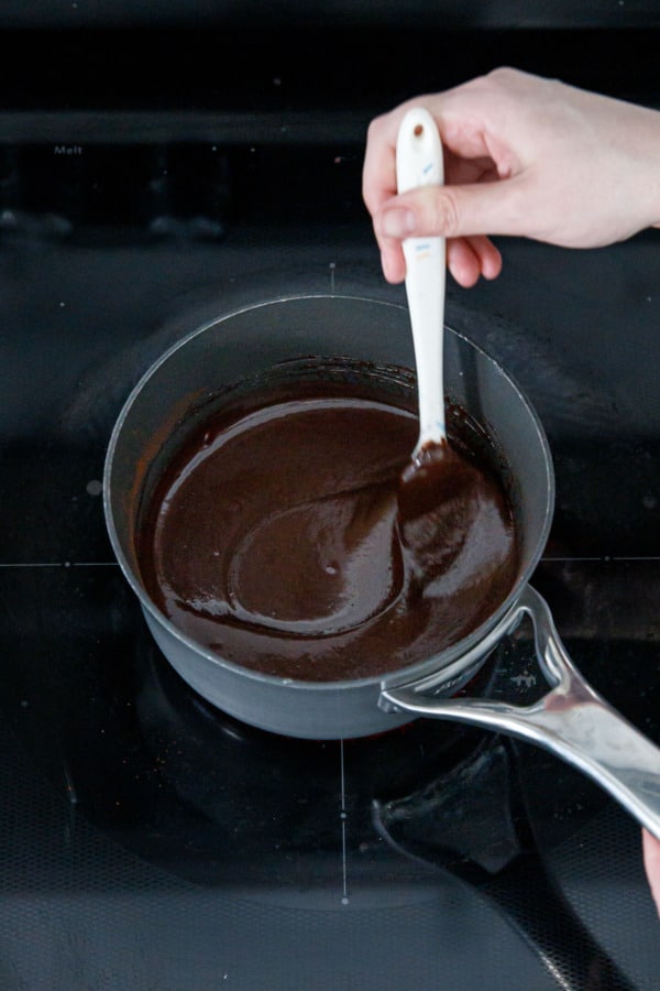 Once it heats up the fudge mixture will thin out and become smooth.