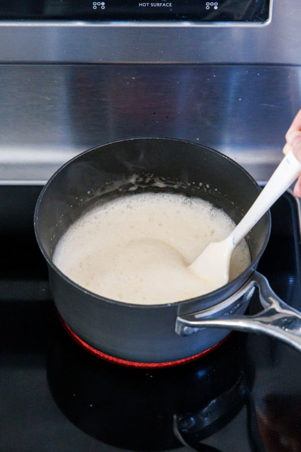 Small saucepan with foamy mixture of pectin, baking soda, and water.