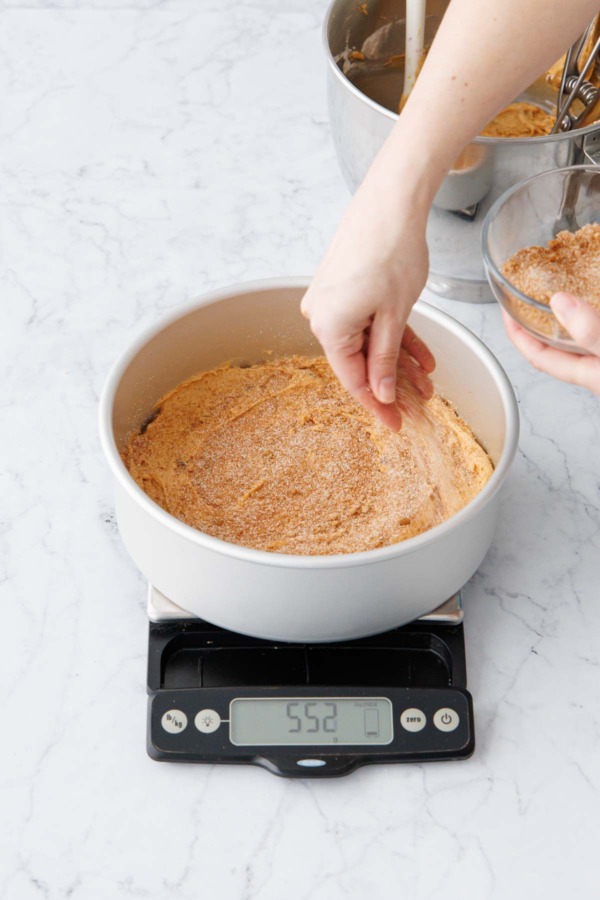 Sprinkling with half of cinnamon sugar mixture between layers of batter.