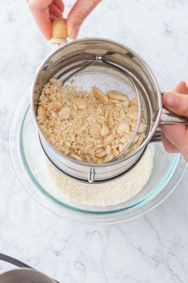 Sifting the first coarse grind of the almond flour.