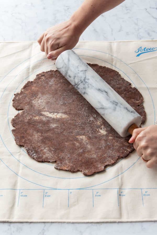 Rolling the dough to about 14-inches in diameter (to fit a 9-inch pie pan).