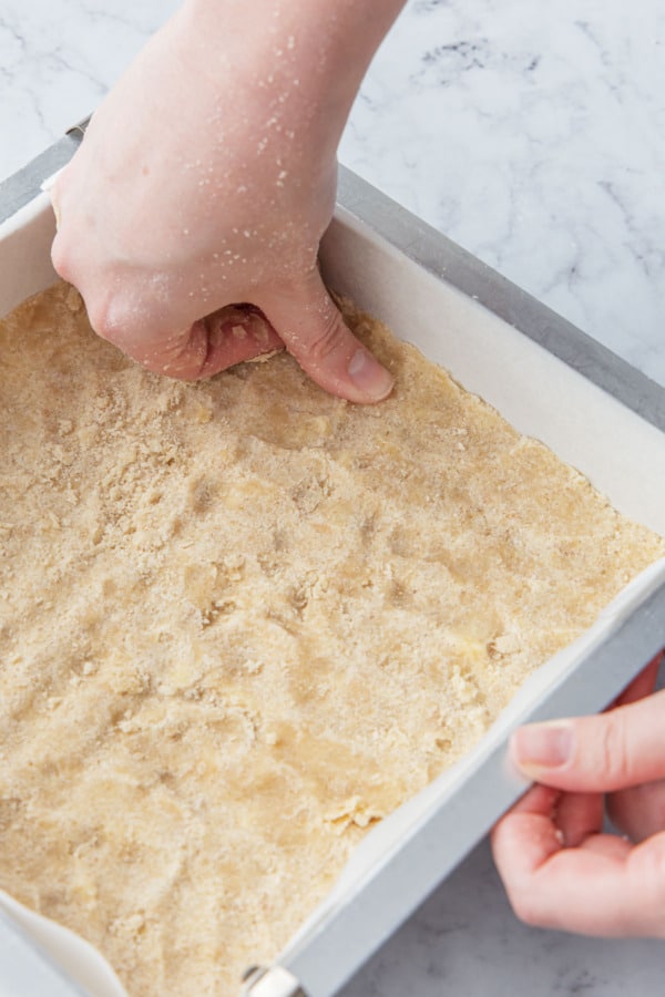 Leave a small rim around the edge of the pan, which will help the filling stay in place and not leak over the sides.