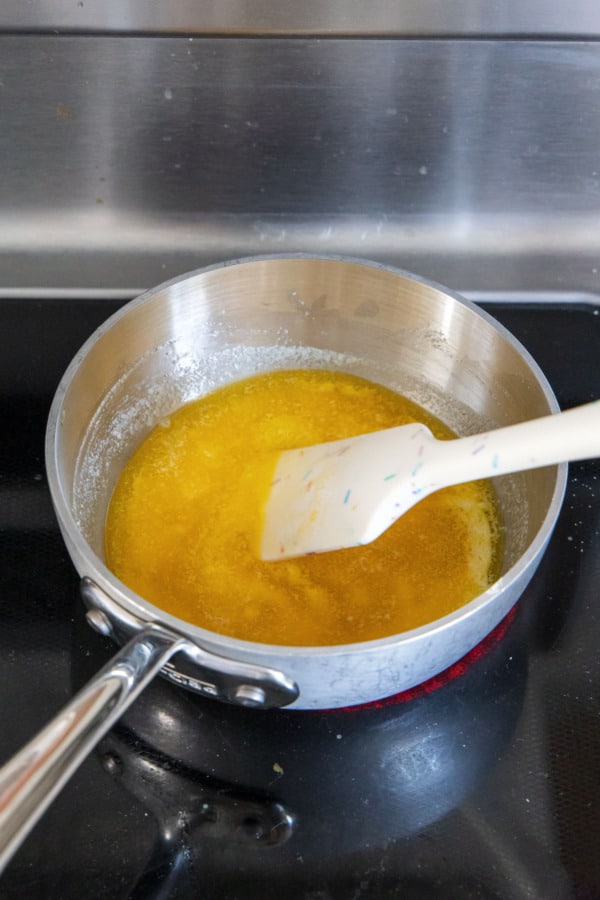 Melting butter in a small saucepan to make brown butter.
